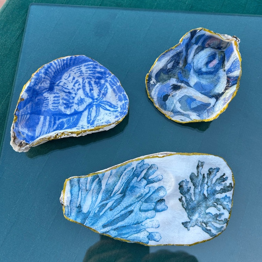 Decorative blue and white decoupaged oyster shells.